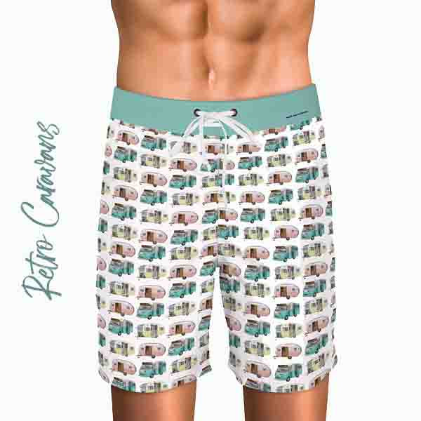 man wearing board shorts with the retro caravan repeat pattern by Jenni Rogers artist